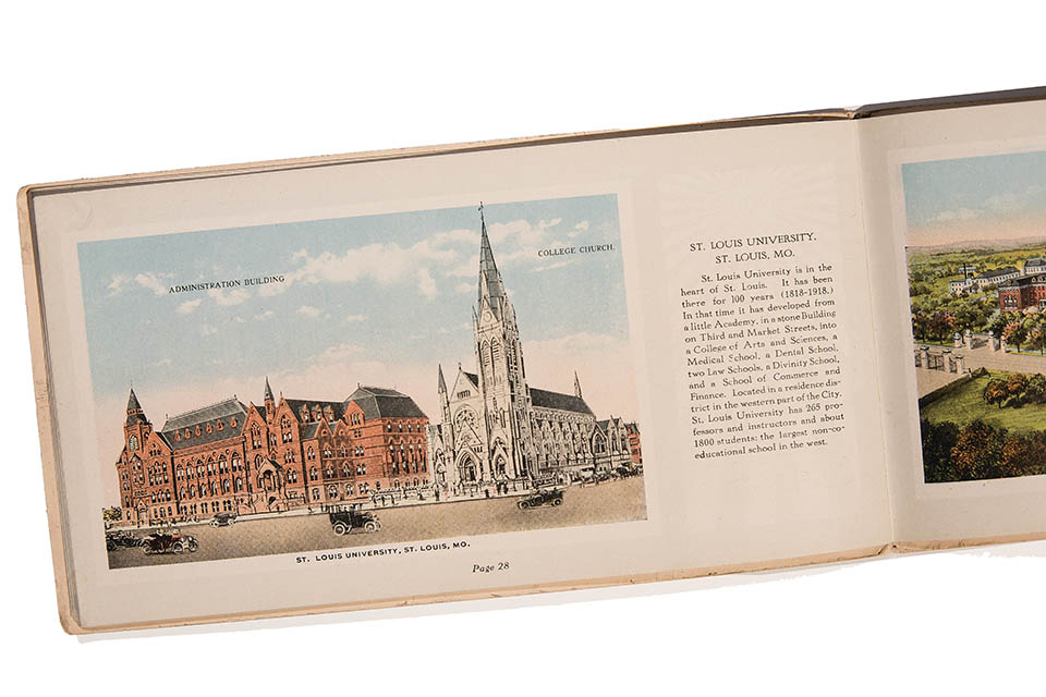 Book open to an illustration of DuBourg Hall and College Church