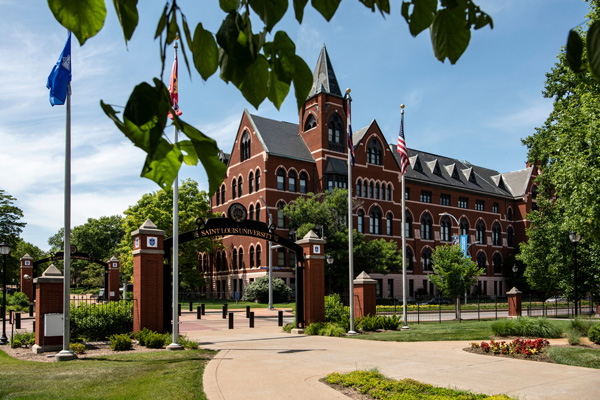 DuBourg Hall at Saint Louis University, with a campus gateway and sidewalk